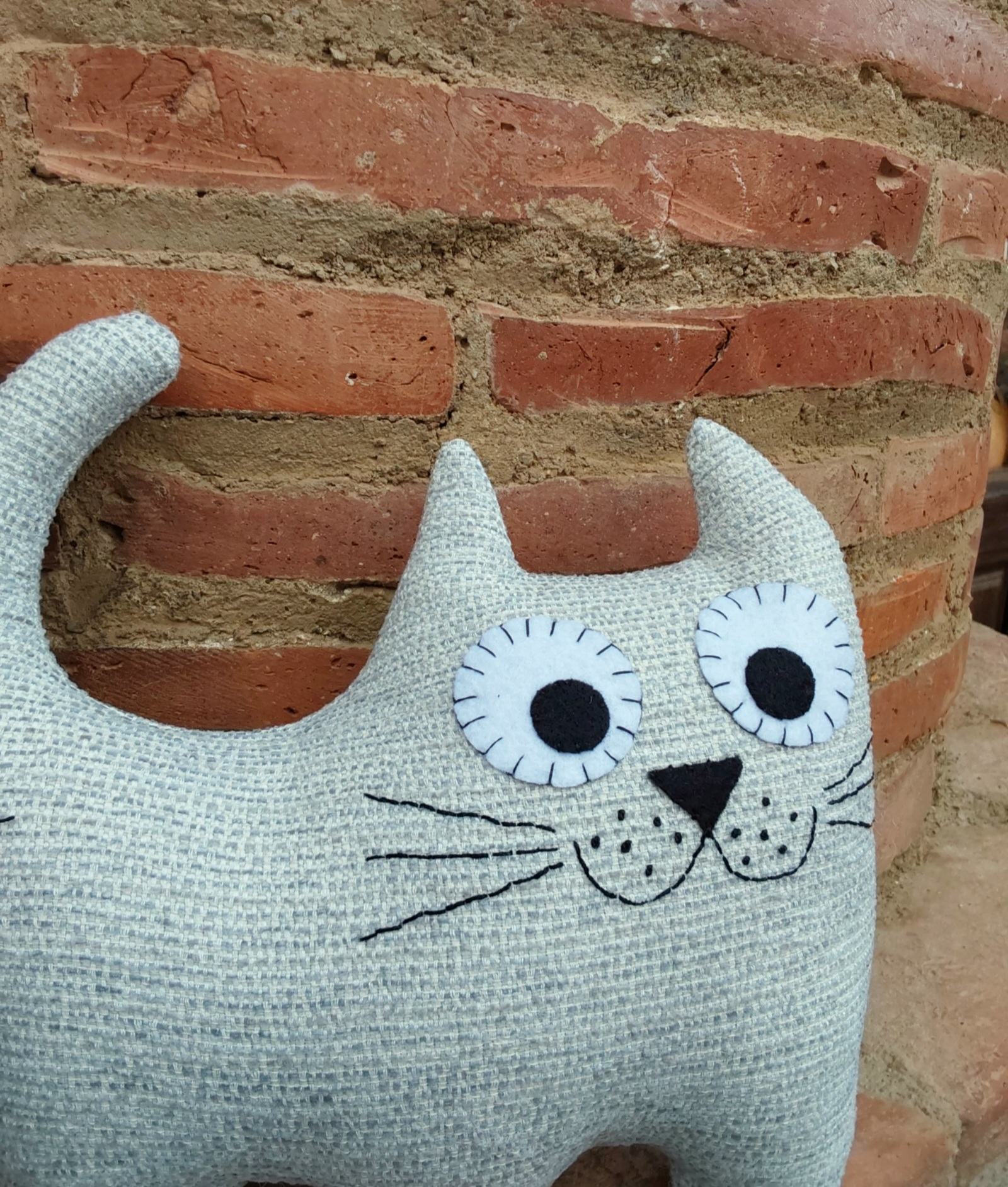 Cojín gato tapicería gris